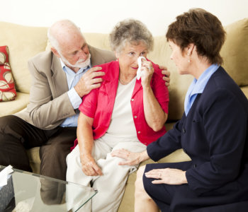 old couple and woman talking